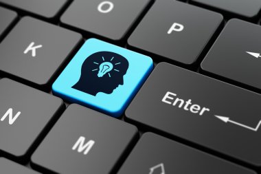 Studying concept: Head With Light Bulb on computer keyboard background