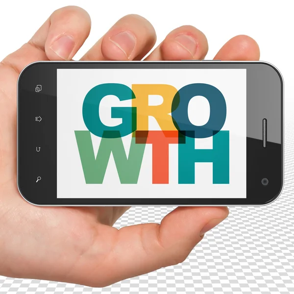 Geschäftskonzept: Smartphone mit Wachstum in der Hand — Stockfoto