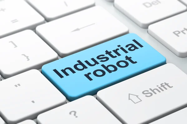 Концепция отрасли: Промышленный робот на фоне клавиатуры компьютера — стоковое фото