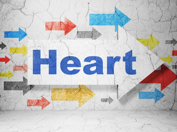 Концепція медицини: стрілка з серцем на гранжевому фоні стіни — стокове фото