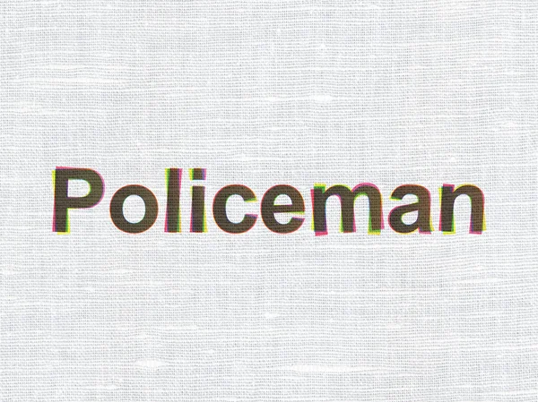 Έννοια του νόμου: αστυνομικός σε ύφασμα υφή φόντου — Φωτογραφία Αρχείου