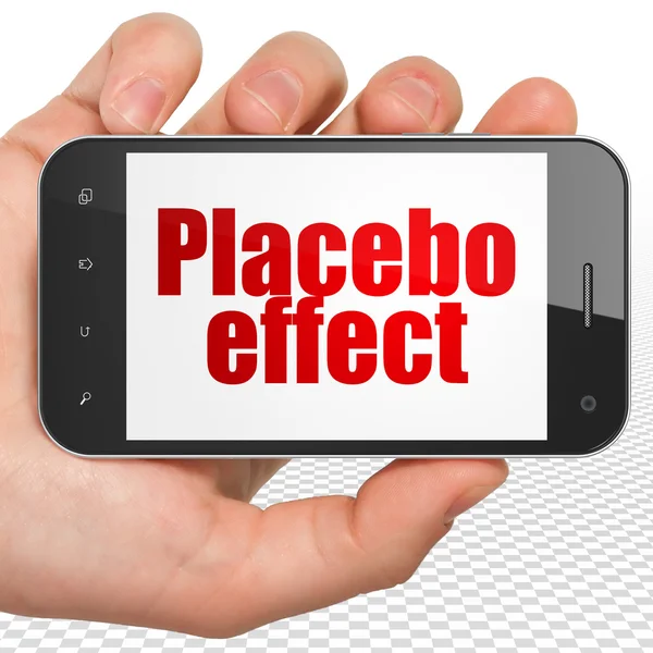 Health concept: Hand Holding Smartphone with Placebo Effect on display — Stock Photo, Image