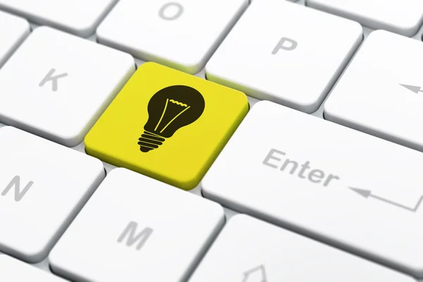 Finance concept: Light Bulb on computer keyboard background — Stock Photo, Image