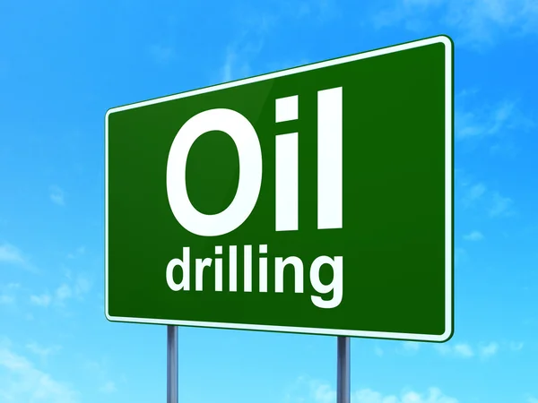 Conceito de fabricação: Oil Drilling on road sign background — Fotografia de Stock