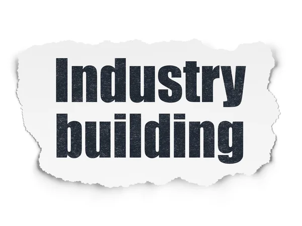 Manufacuring koncept: industri byggnad på sönderrivet papper bakgrund — Stockfoto