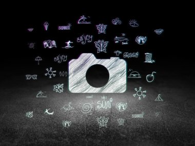 Travel concept: Photo Camera in grunge dark room