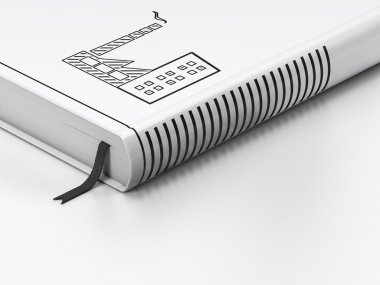 Finance concept: closed book, Industry Building on white background