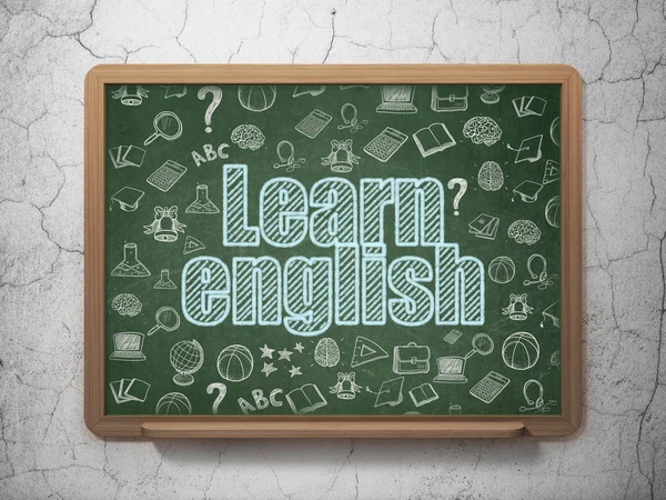 Learning concept: Learn English on School board background — стокове фото
