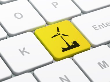 Manufacuring kavramı: bilgisayar klavye arka plan üzerinde yel değirmeni