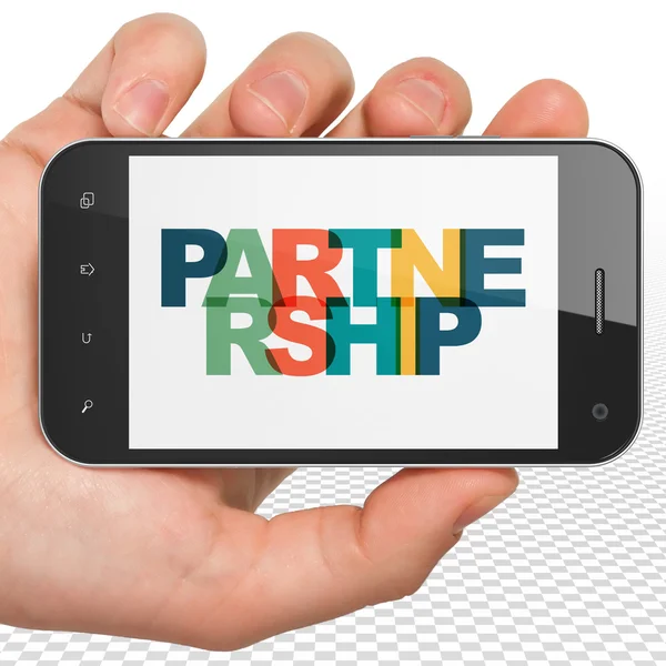 Businesskonzept: Smartphone in der Hand und Partnerschaft auf dem Display — Stockfoto
