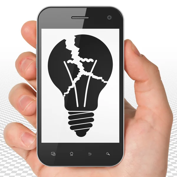 Business concept: Hand Holding Smartphone with Light Bulb on display — Zdjęcie stockowe