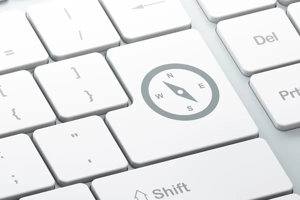 Travel concept: Compass on computer keyboard background — Zdjęcie stockowe