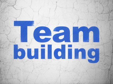 Ekonomi kavramı: duvar arka plan üzerinde ekip oluşturma