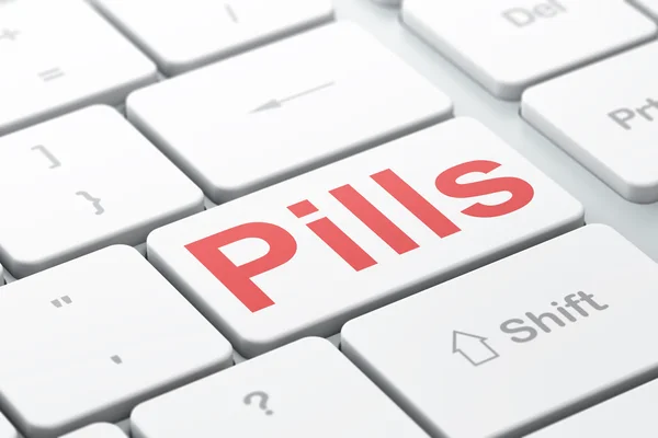 Gezondheidszorg concept: pillen op computer toetsenbord achtergrond — Stockfoto