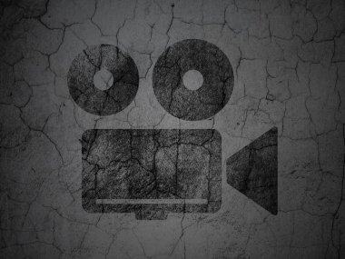Vacation concept: Camera on grunge wall background