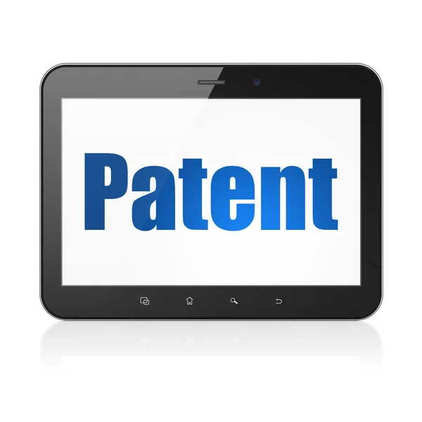 Понятие закона: планшетный компьютер с патентом на дисплее — стоковое фото