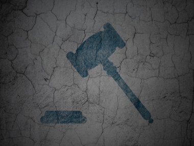 Law concept: Gavel on grunge wall background