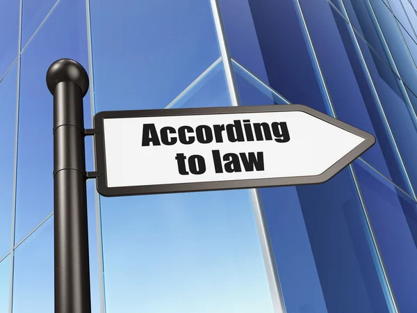 Law concept: sign According To Law on Building background — Stock Photo, Image