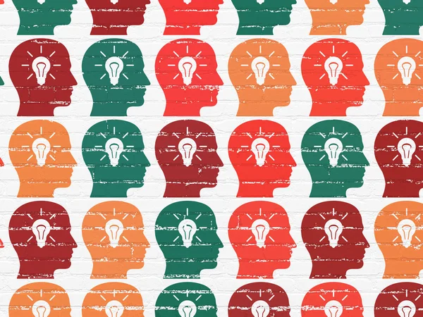 Marketing concept: Head With Light Bulb icons on wall background — Stock Photo, Image