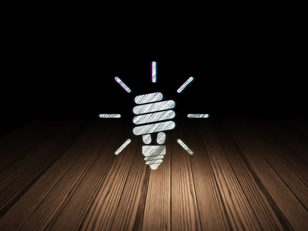 Concept de financement : Lampe économiseuse d'énergie dans une pièce sombre grunge — Photo