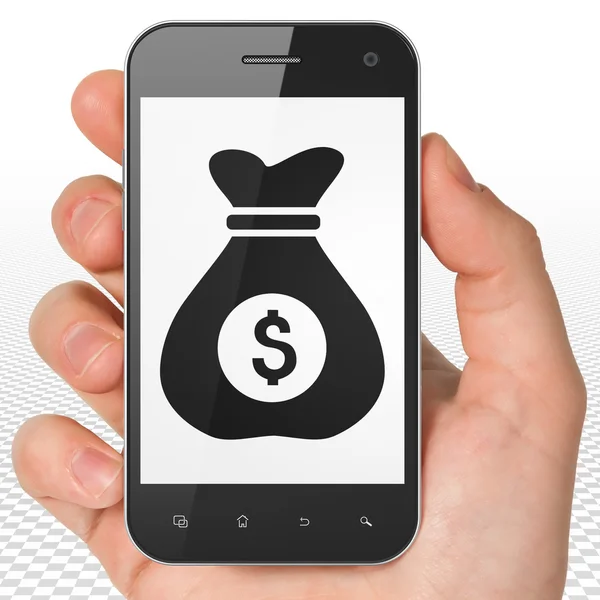 Finance concept: Money Bag on Hand Holding Smartphone display — Stockfoto