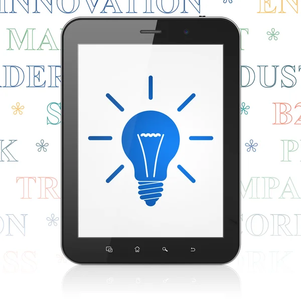 Concept de finance : Tablette avec ampoule à l'écran — Photo