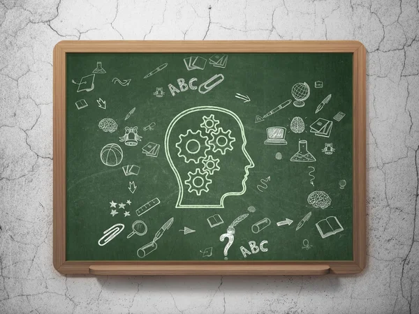 Education concept: Head With Gears on School Board background — 图库照片