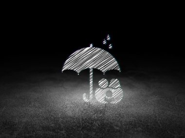 Insurance concept: Umbrella in grunge dark room