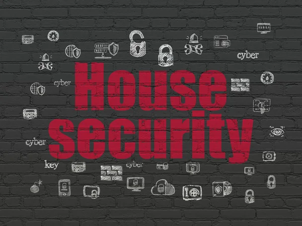 Концепция безопасности: Охрана дома на стене — стоковое фото