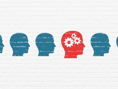 Business concept: head with gears icon on wall background