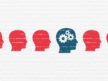 Studying concept: head with gears icon on wall background