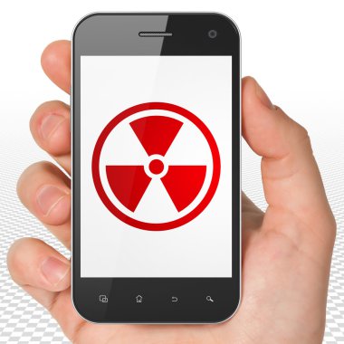 Science concept: Hand Holding Smartphone with Radiation on display