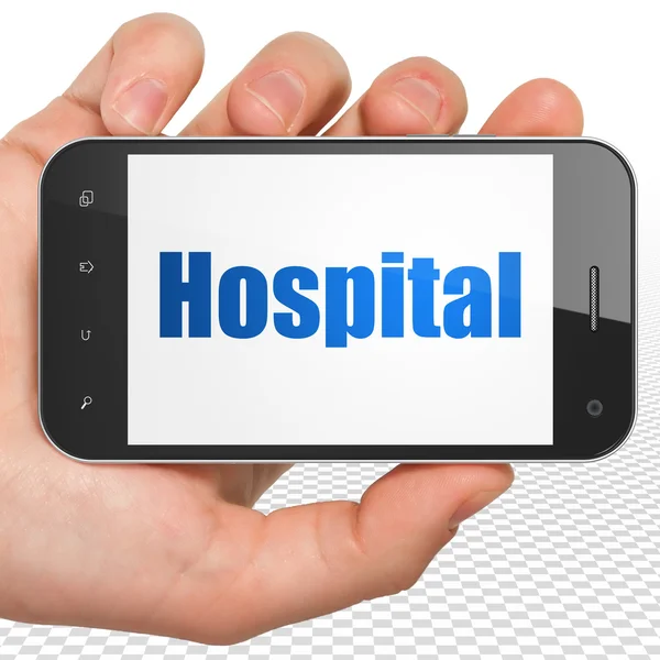 Health concept: Hand Holding Smartphone with Hospital on display — Stockfoto