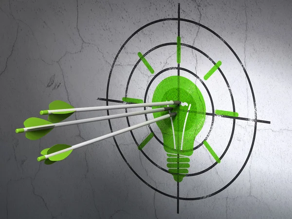 Finance concept: arrows in Light Bulb target on wall background — Stock Photo, Image