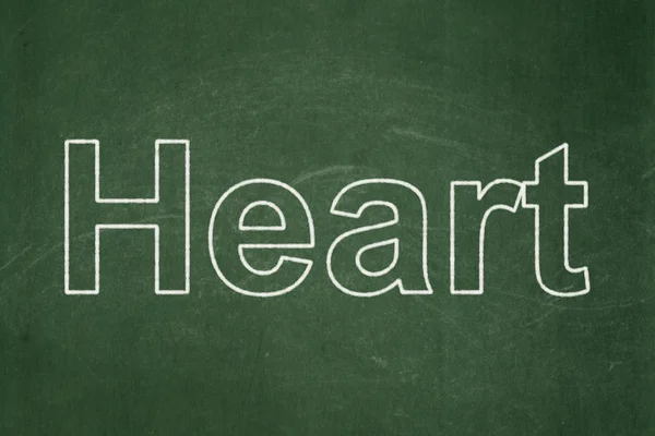 Tıp kavramı: Kara tahta arka plan üzerinde kalp — Stok fotoğraf