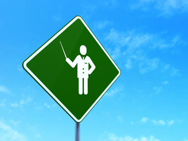 Studying concept: Teacher on road sign background — Stock Photo, Image
