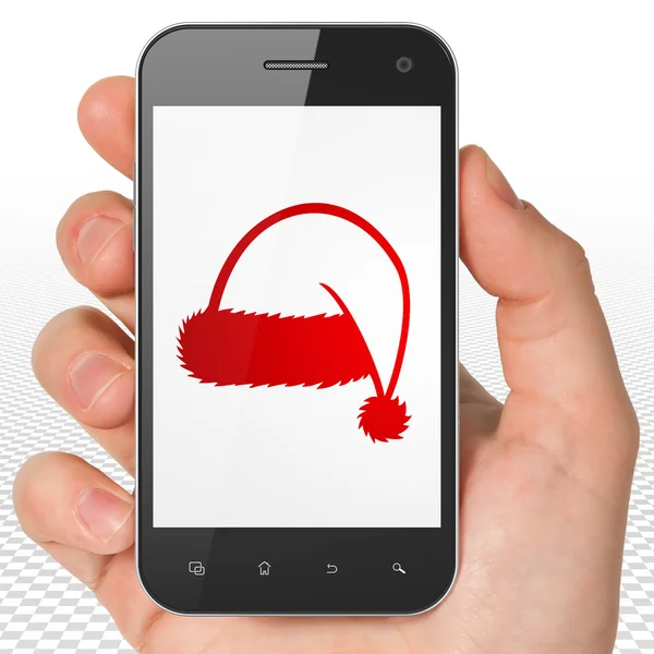 娱乐、 概念： 圣诞帽子上显示的手拿着智能手机 — 图库照片