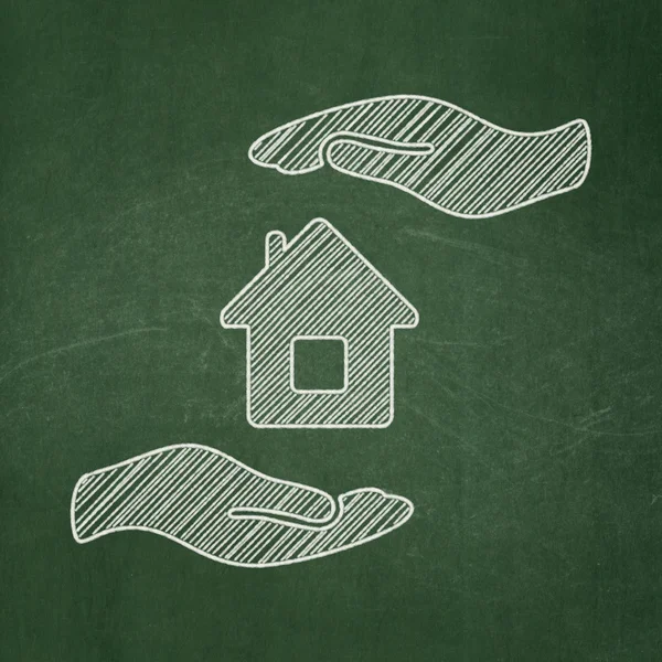 Insurance concept: House And Palm on chalkboard background — Stock Photo, Image