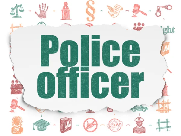 Έννοια του νόμου: αξιωματικός της αστυνομίας, σε φόντο σχισμένο χαρτί — Φωτογραφία Αρχείου