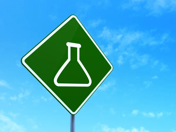 Science concept: Flask on road sign background — 图库照片