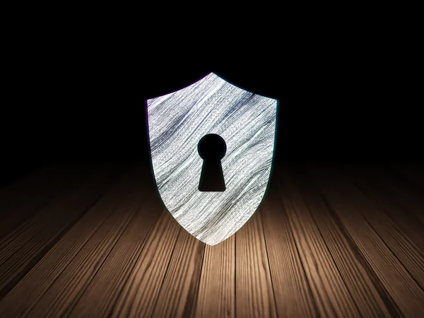 Security concept: Shield With Keyhole in grunge dark room — Stockfoto