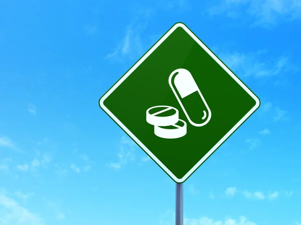 Concept de santé : pilules sur fond de panneau routier — Photo