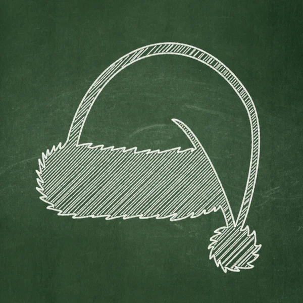 Entertainment, concept: Christmas Hat on chalkboard background — 图库照片