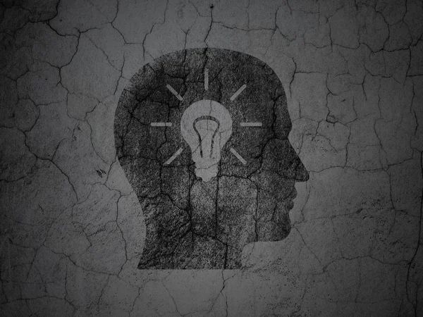 Learning concept: Head With Light Bulb on grunge wall background — Stock Fotó