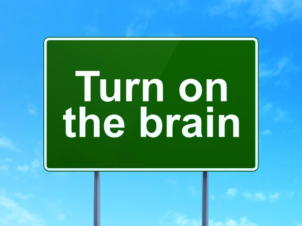 Learning concept: Turn On The Brain on road sign background — Stock fotografie