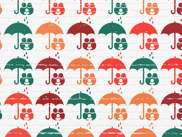 Protection concept: Family And Umbrella icons on wall background — Stock fotografie