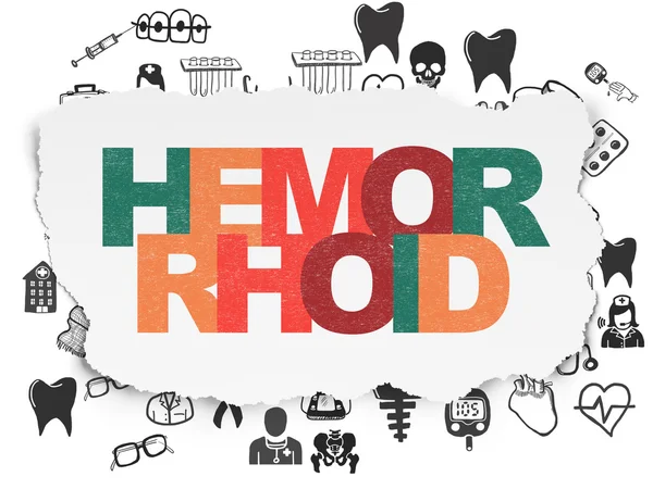Conceito de saúde: Hemorróide no fundo papel rasgado — Fotografia de Stock