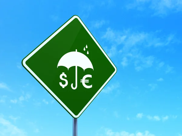 Protection concept: Money And Umbrella on road sign background — Stok fotoğraf