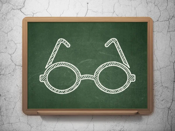 Science concept: Glasses on chalkboard background — Stockfoto