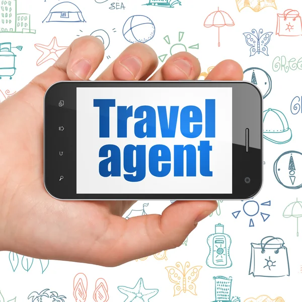 Tourism concept: Hand Holding Smartphone with Travel Agent on display — Stockfoto